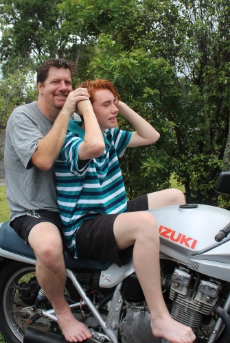 Father and teenage son on Katana motorcycle. Su Leslie, 2016
