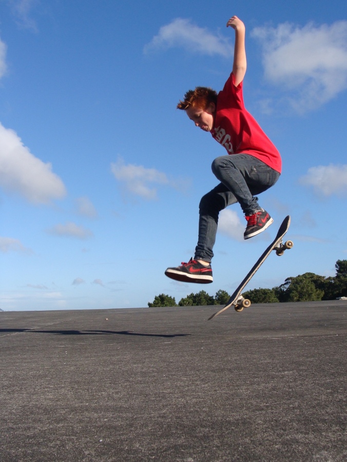 Skateboarding boy airborne. Image: Su Leslie, 2010