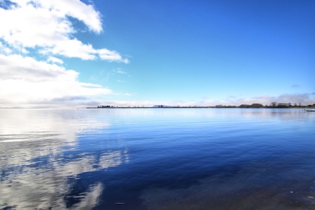 Clear skies to the right; Lake Taupo at Waihi Reserve, near Turangi, North Island, NZ