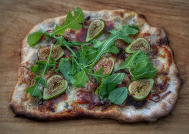 Using up the fig harvest; on sourdough pizza with rocket, gorgonzola and proscuitto. Image: Su Leslie 2019